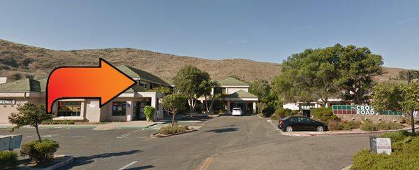 In the Crossroads Center, above Crossroads Liquor.