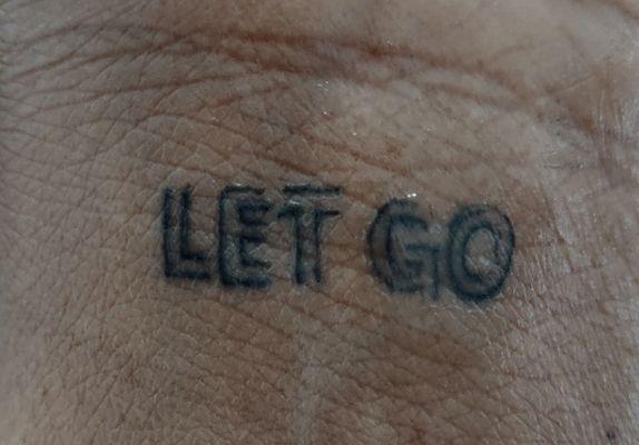 Crooked lopsided tattoo