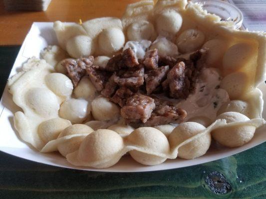 Waffle with maple sausage and onion, chive cream cheese. Delicious!