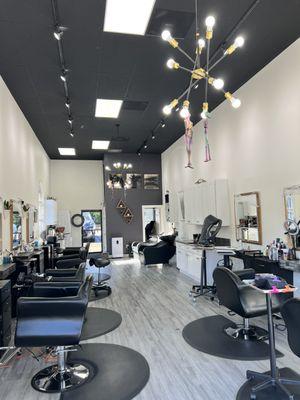 Clean and modern salon with high ceilings