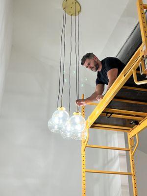 Hanging chandeliers from various heights