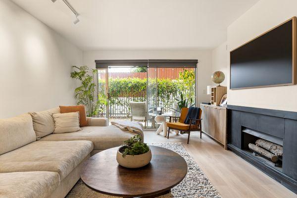 Natural Light for Days - Large sliding glass doors open to a peaceful patio--indoor-outdoor living at its best.