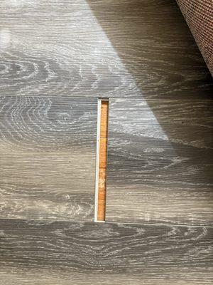 Middle of the living room floor that just came apart