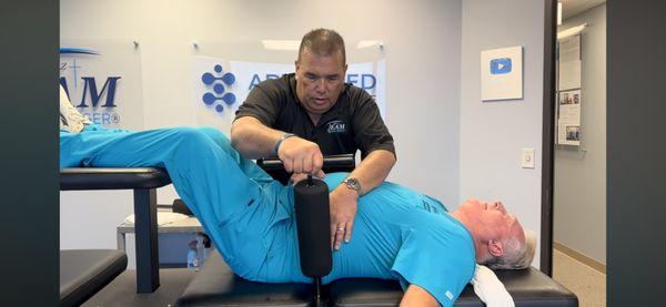 Dr. Phil Locking in Dr. Johnson's Hips readying him for the Ring Dinger Adjustment. The Ring Dinger works immediately for most people.