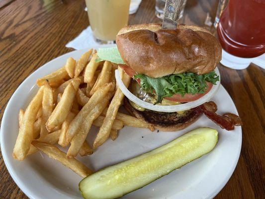 Bacon burger, side of fries & pickle.