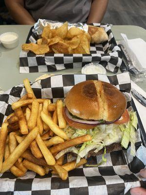 Avocado Swiss burger with fries and chicken shawarma with homemade chips