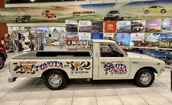Cool old Toyota Pickup in the showroom. When Toyota Pickups were basic and affordable.