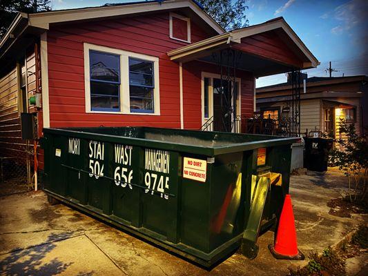 10 cubic yard dumpster rental in Bywater neighborhood in New Orleans for home cleanup project.
