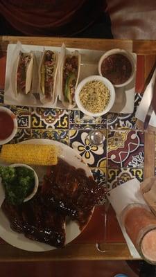 Ribs with Dr Pepper sauce and veggie sides or Ribeye Tacos rice and black beans!