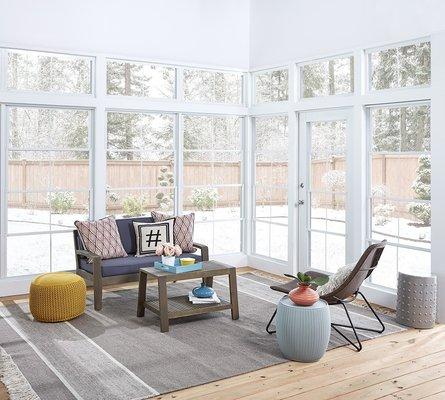 Vinyl glass Eze Breeze sunroom with fixed transoms above the windows