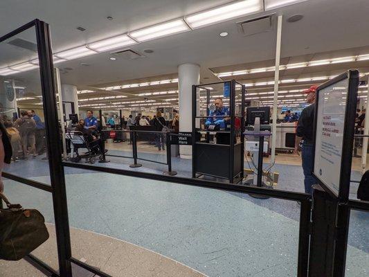 View of the security area from the TSA PreCheck line. PreCheck agents (2) and line were located to the left of this photo.
