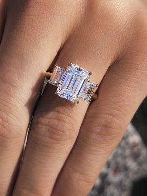 three stone emerald cut engagement ring