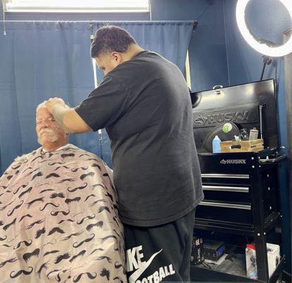 Awesome hair cut by Miguel. Love the tool boxes used for their barber stations