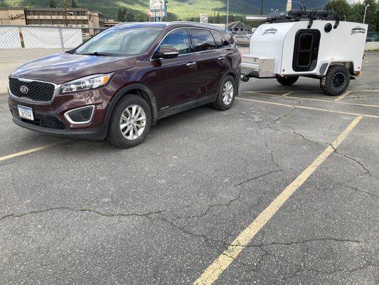 Car towable travel trailer that fits in a garage and a single parking spot. Kinda awesome!