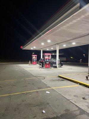 Gas Pumps and parking lot.