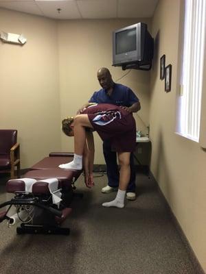 Dr. Akers showing a stretch for her back.