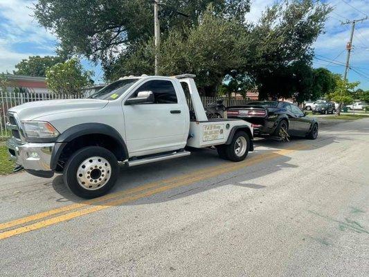 Car being towed to owners destination