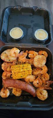 Mediums size shrimp, sausage, potato, and corn
