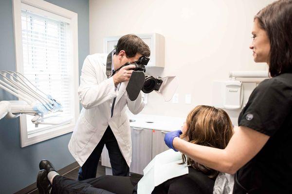 Burlington Dentist, Dr Thomas Monahan taking high quality photos of a patient for cosmetic treatment at Monahan Family & Cosmetic Dentistry