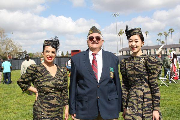 Chaplain Steve Navarro and Veteran Couture Models Decire & Joan during the wall that heals event