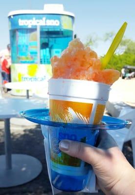 Shaved ice topped with flavorful sweetness...in this case, a mix of banana and strawberry. Wonderful way to beat the heat of Arizona June.