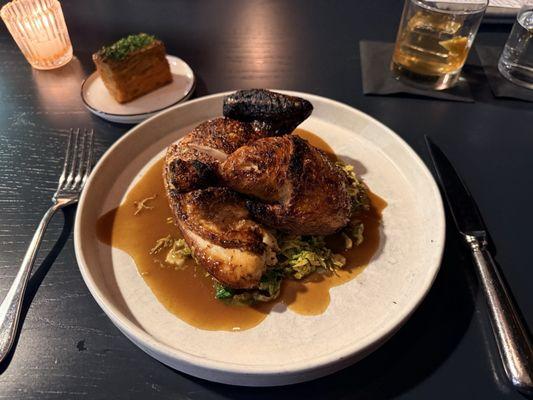 Chicken dish with Brussels sprout slaw and a delicious potato cake. Awesome!