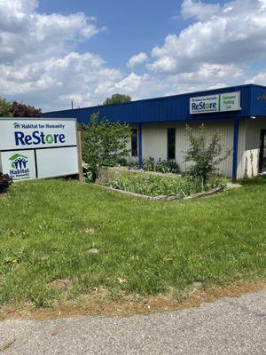 The store entrance sign. It sits down off the road and me you come up the hill, and so it's easy to miss.