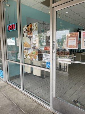 Signs on. Chairs are still up. The female worker still prepping. The tiny hours says 12:00pm -6:30pm