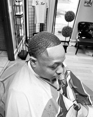 Haircut with enhancements and shave.