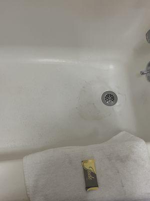 The towel is dirty and the bathtub.