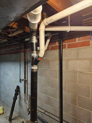 Repipe of cast iron stack and new pvc waste lines.