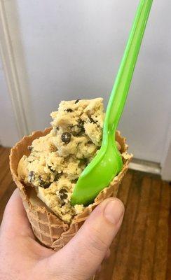 Chocolate chip on top of vanilla in a cone