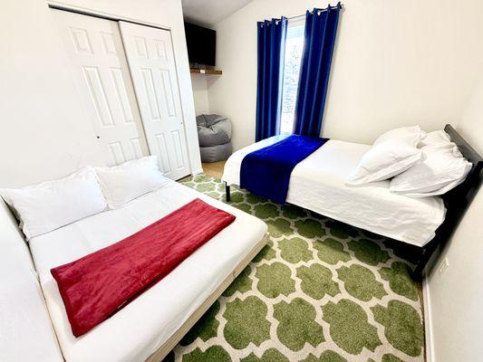 Bedroom 3 has a double trundle bed that rolls out from underneath the full sized bed