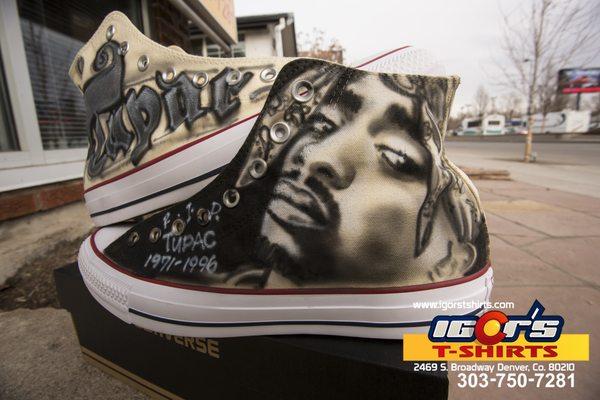 Tupac airbrushed on Chuck Taylors.