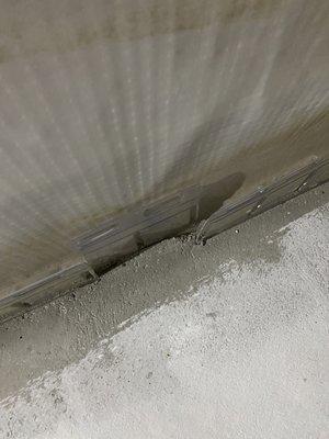 Broken plastic sticking out of the ground