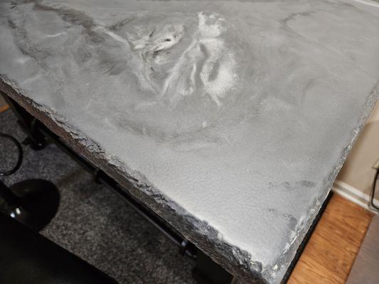 Rock edge epoxy bar top.