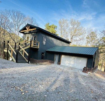 After exterior renovation project. Installed Zip R-panel sheathing, James Hardie Fiber Cement siding, brick, and front and back deck