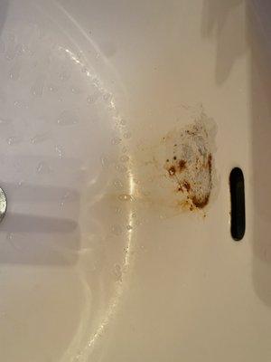 Rusted sink in bathroom