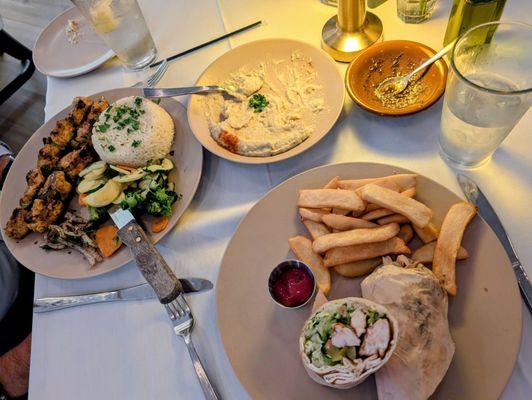 Chicken skewer entree, tawook sandwich, and babaganoush appetizer.