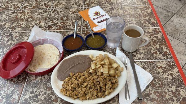 The Chorizo con Huevo breakfast featuring flour tortillas and red and green salsa! Sooo good!