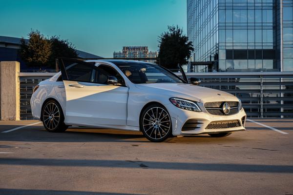 Fully Equipped 2021 Mercedes Benz C-Class AMG Available for rent. Polar White Exterior & Black Leather Interior.