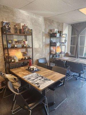 Two 4-person tables. There is space at the bottom of the shelves for you to put your belongings.