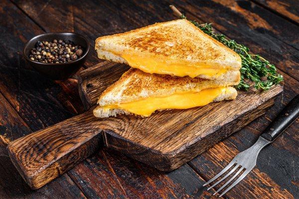Homemade grilled cheese sandwich using Amish butter, butter cheese, and bacon american purchased at Slice of Amish.