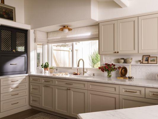 A timeless San Clemente kitchen remodel blending natural materials and layered design - crafted for comfort and function.