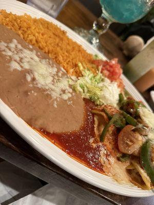 Cheese enchiladas with red and green sauce.