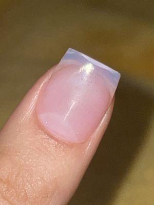 The acrylic and nail tip separated at the top because she applied the acrylic first and then cut off the nail tip to my desired length.