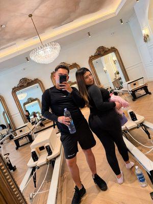 Pilates reformer mirrors, chandelier