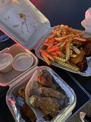 Garlic parmesan chicken, lemon pepper wings, and fries