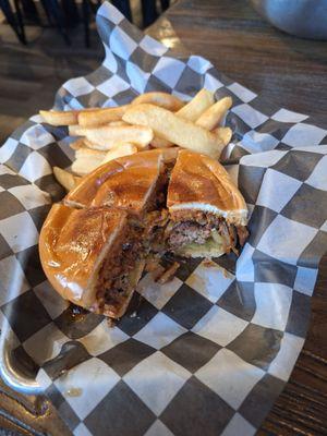 The gunslinger, a spicy sausage patty on an Angus patty with bacon, grilled onions and an excellent BBQ sauce!