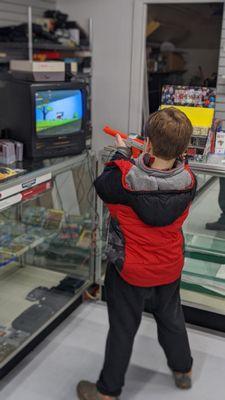 Kids discovering the classics for the first time. Stop in and play some Duck Hunt on our complementary CRT setup!